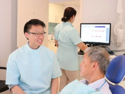 Dr Tong with Dental Patient